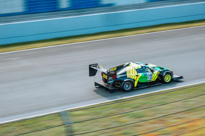 Black-and-green race car with extreme aerodynamic bodywork