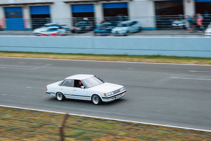 White classic sedan on the straight