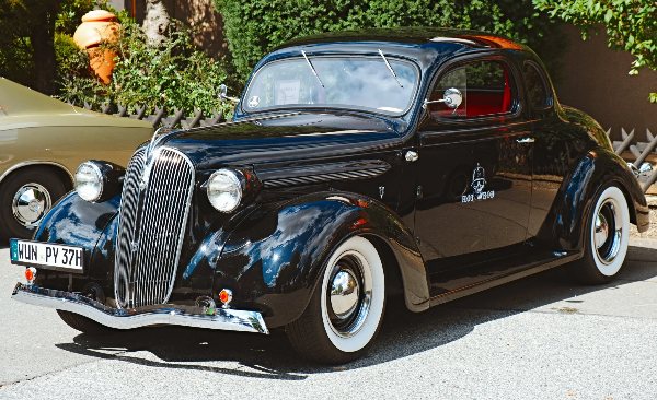 Black 1930s Ford hot rod with whitewall tyres