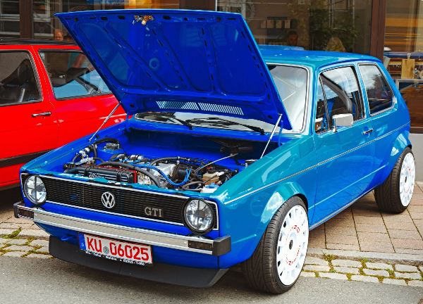 Blue Volkswagen Golf GTI with the bonnet open