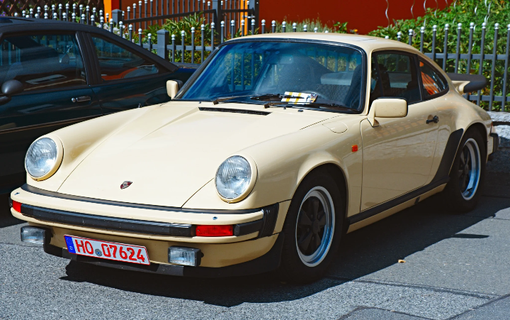 Cream Porsche 911, front three-quarter