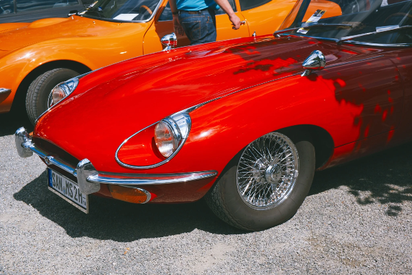 Red Jaguar E-Type in the afternoon sun